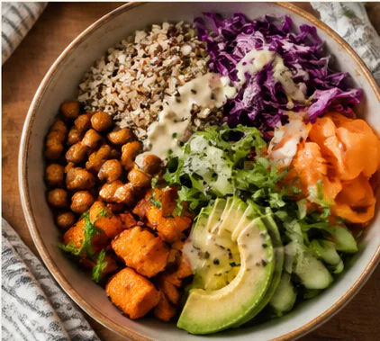 A colourful grain bowl with vegetables, chickpeas and avocado